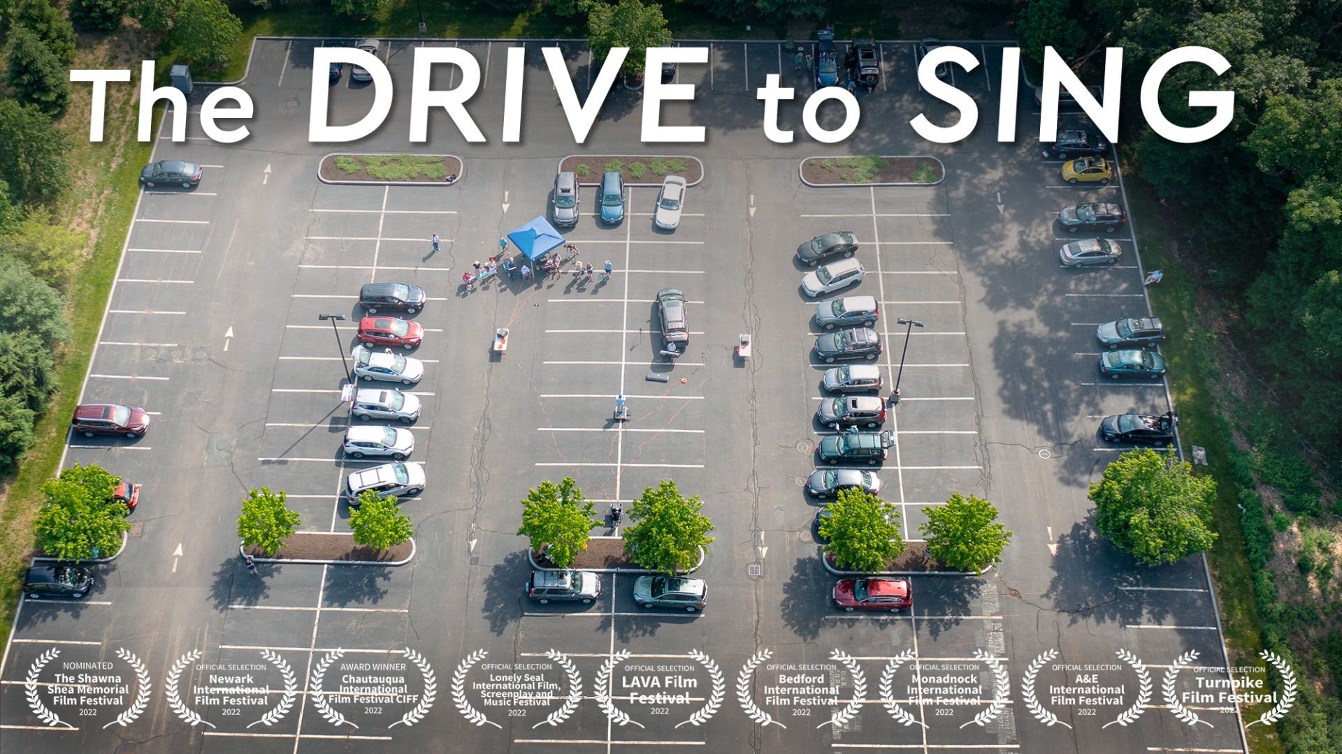 Film poster featuring 17 cars in parking lot, arranged in a circle around a conductor standing in the middle