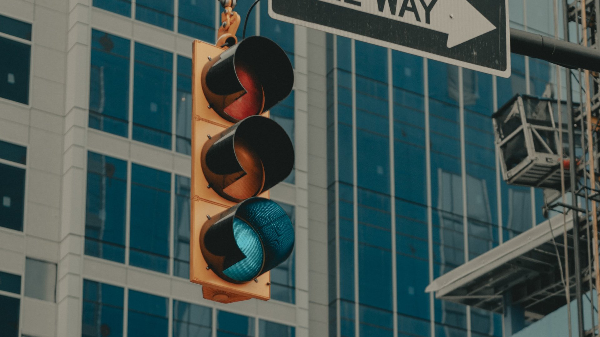 Traffic light in an intersection with green light lit up