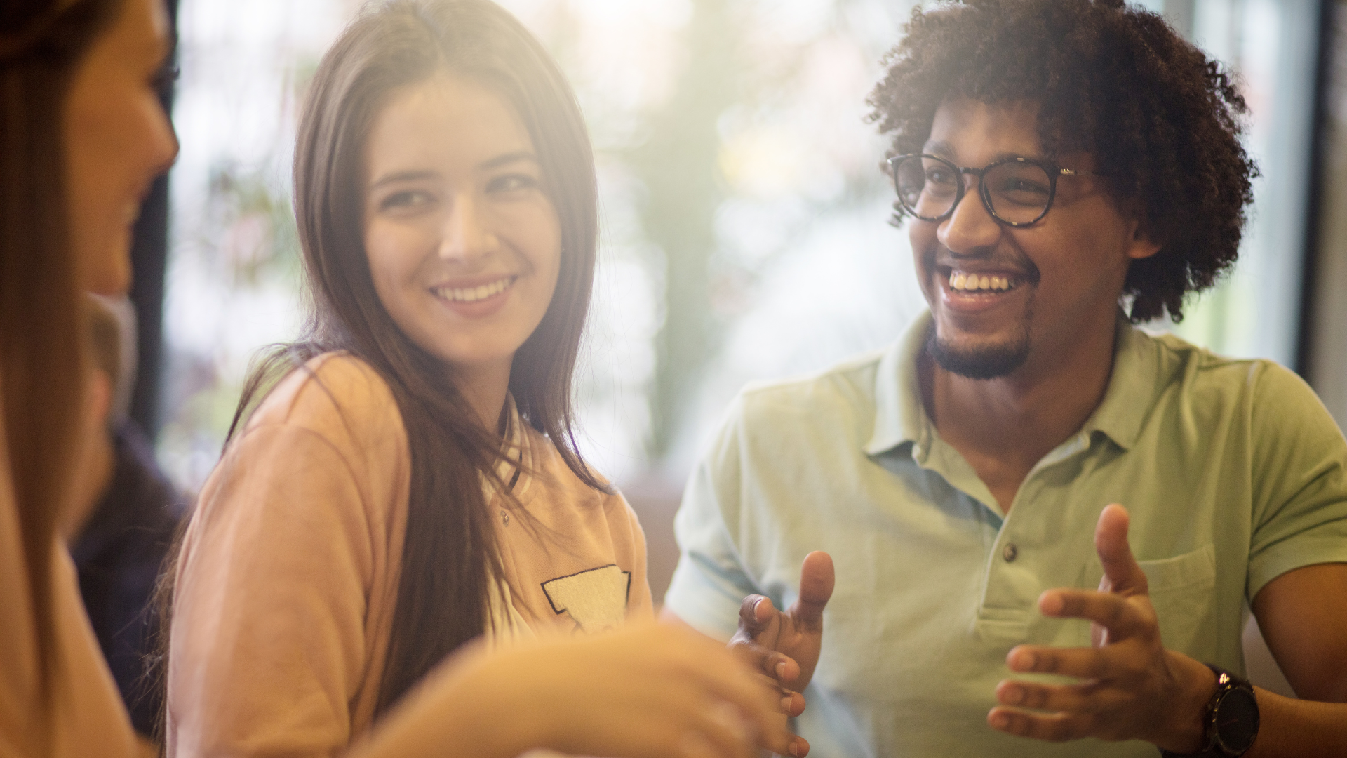 Two people smiling and engaged in conversation
