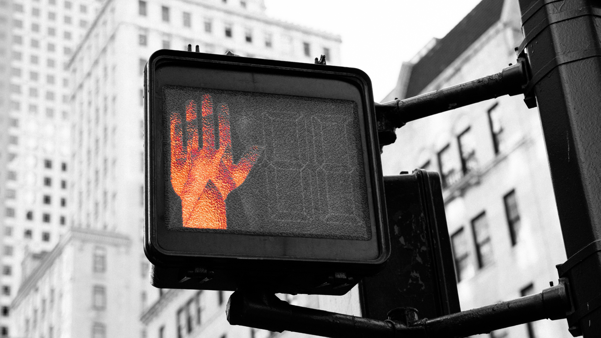 closeup photo of street go and stop signage displaying a red raised 'stop' hand