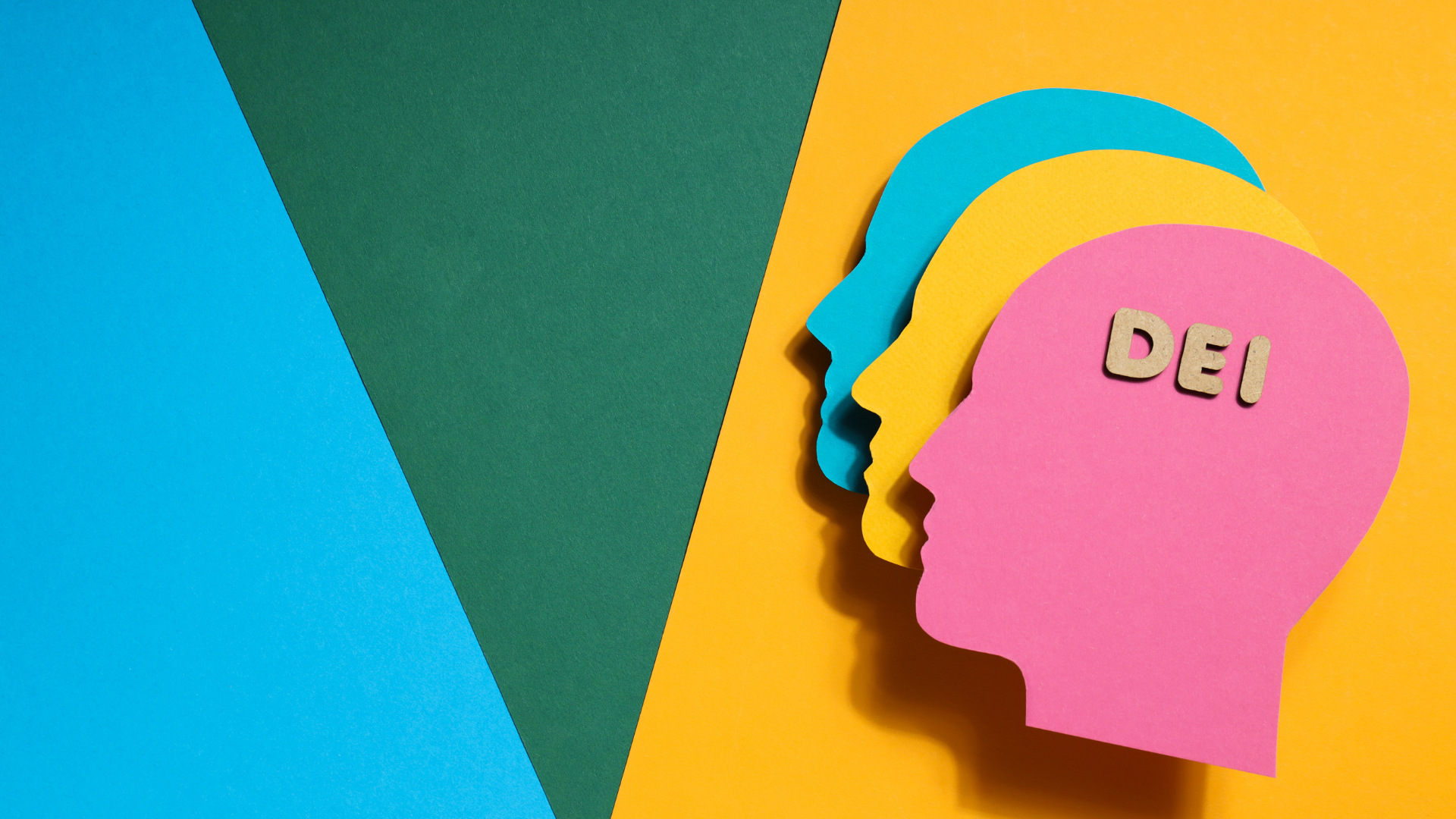 Colorful layered paper cutouts of a person's profile