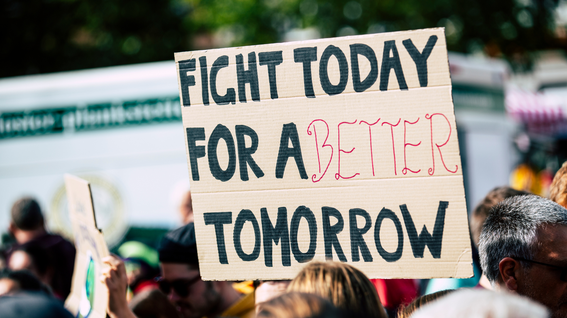Photo of a handmade protest sign that reads "Fight today for a better tomorrow"