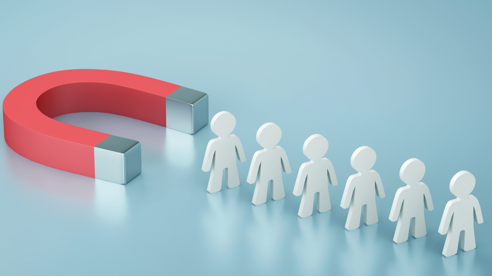Illustration of a red horseshoe magnet attracting a line of simplified human figures, symbolizing recruitment, attraction, or audience engagement.