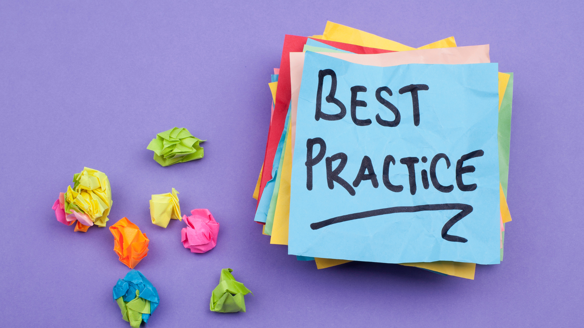 "Best Practice" is written on a stack of colorful Post-It notes.