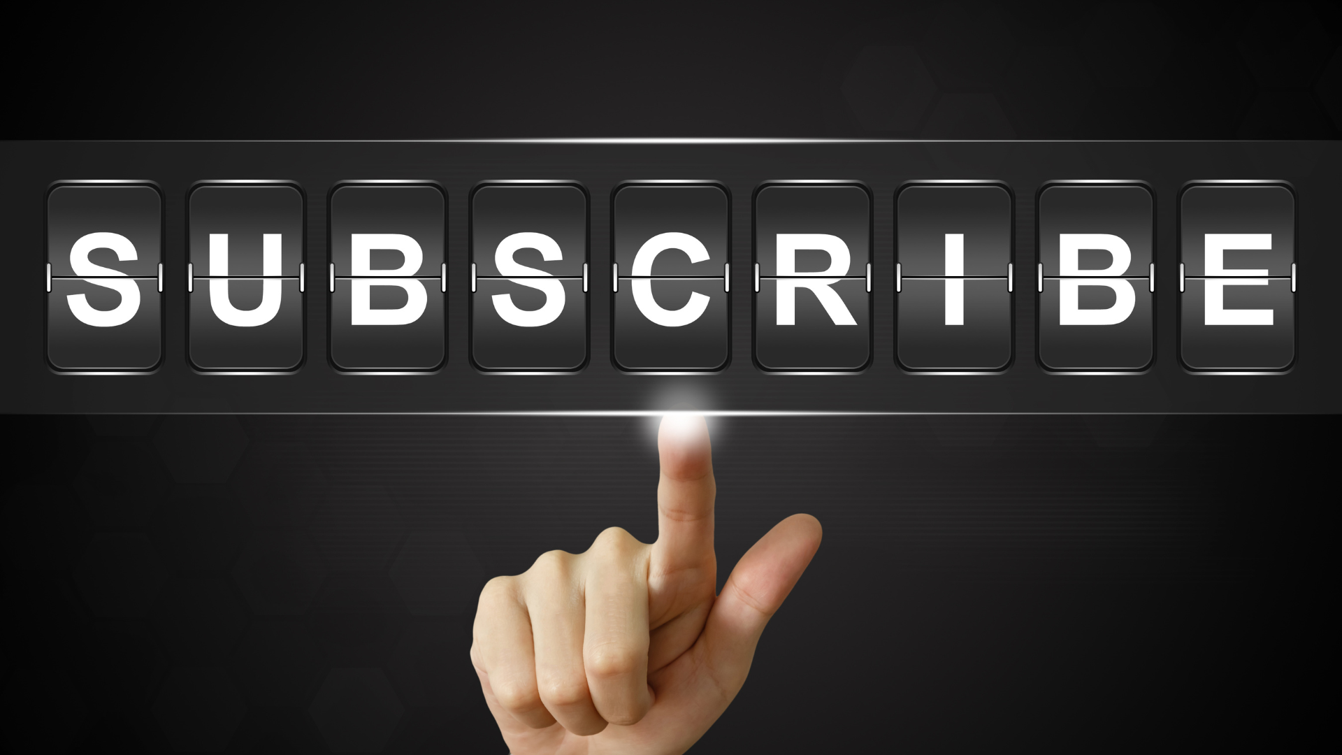 A photograph of a hand pressing a button that says "Subscribe"
