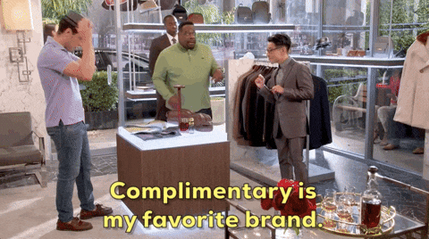 GIF of men shopping in a fancy department store saying complimentary is my favorite brand