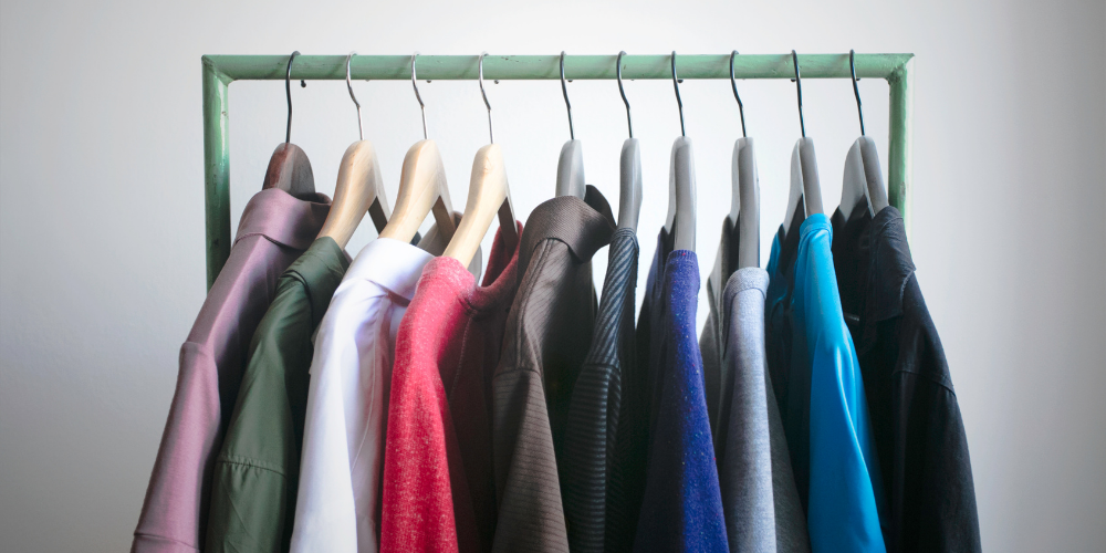 Male and female clothes on a rack