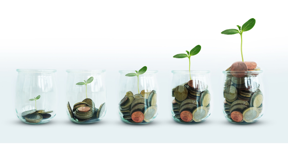 Clear jars with coins representing growing donations.