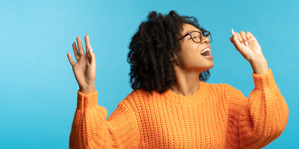 Woman singing with hand gestures