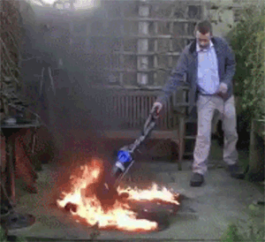 A man vacuuming a fire on his carpet