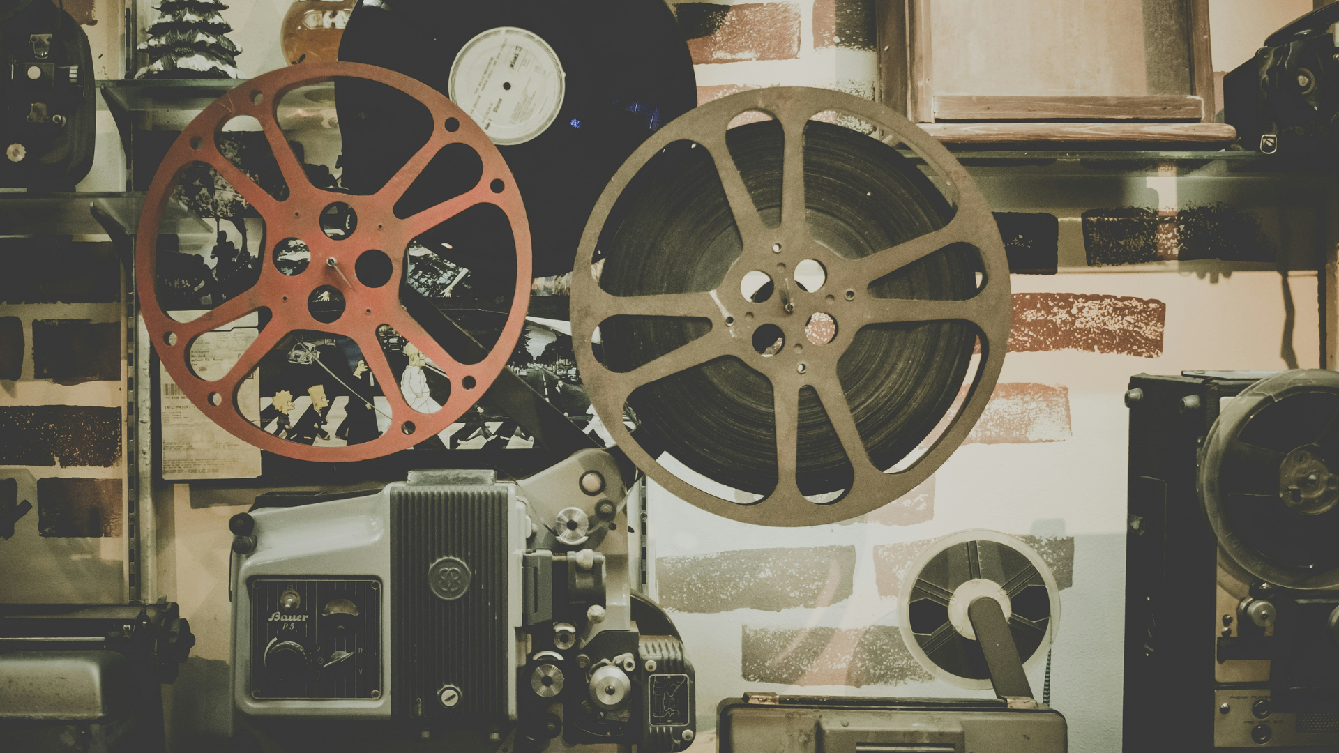 closeup photo of two vintage film reels in a cinematographer’s room