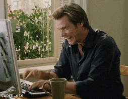 GIF of actor Jim Carrey typing on a computer keyboard in a frenzied manner