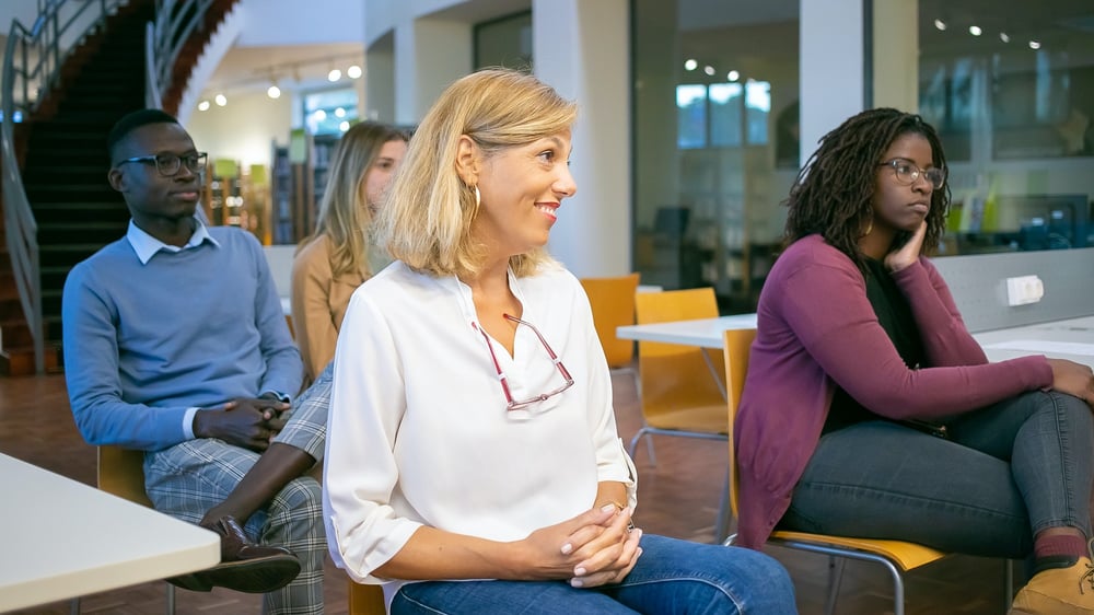 Parents listening at a meeting